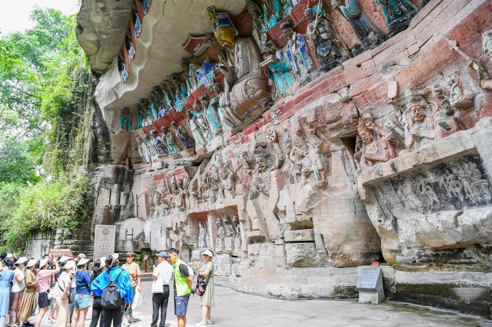 Tourists visit scenic spot of Dazu Rock Carvings in China's Chongqing